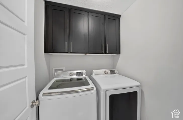 Dark-toned upper cabinetry with silver-tone hardware