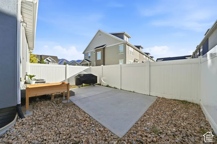 Concrete patio with surrounding gravel landscaping