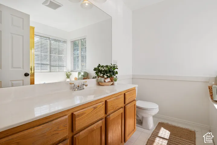 Spacious vanity with wood-finish cabinetry,