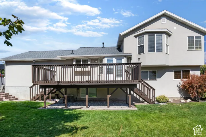 Expansive wooden deck with railing and stairs