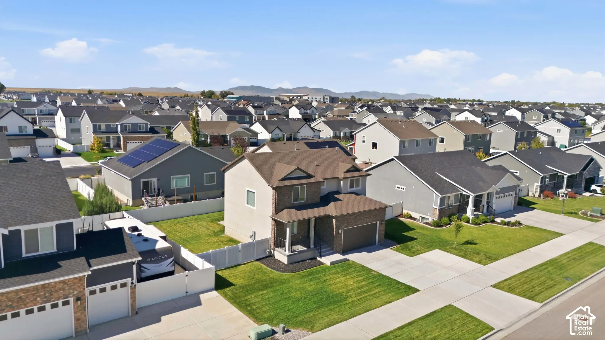 Aerial shot of front of home and neighborhood