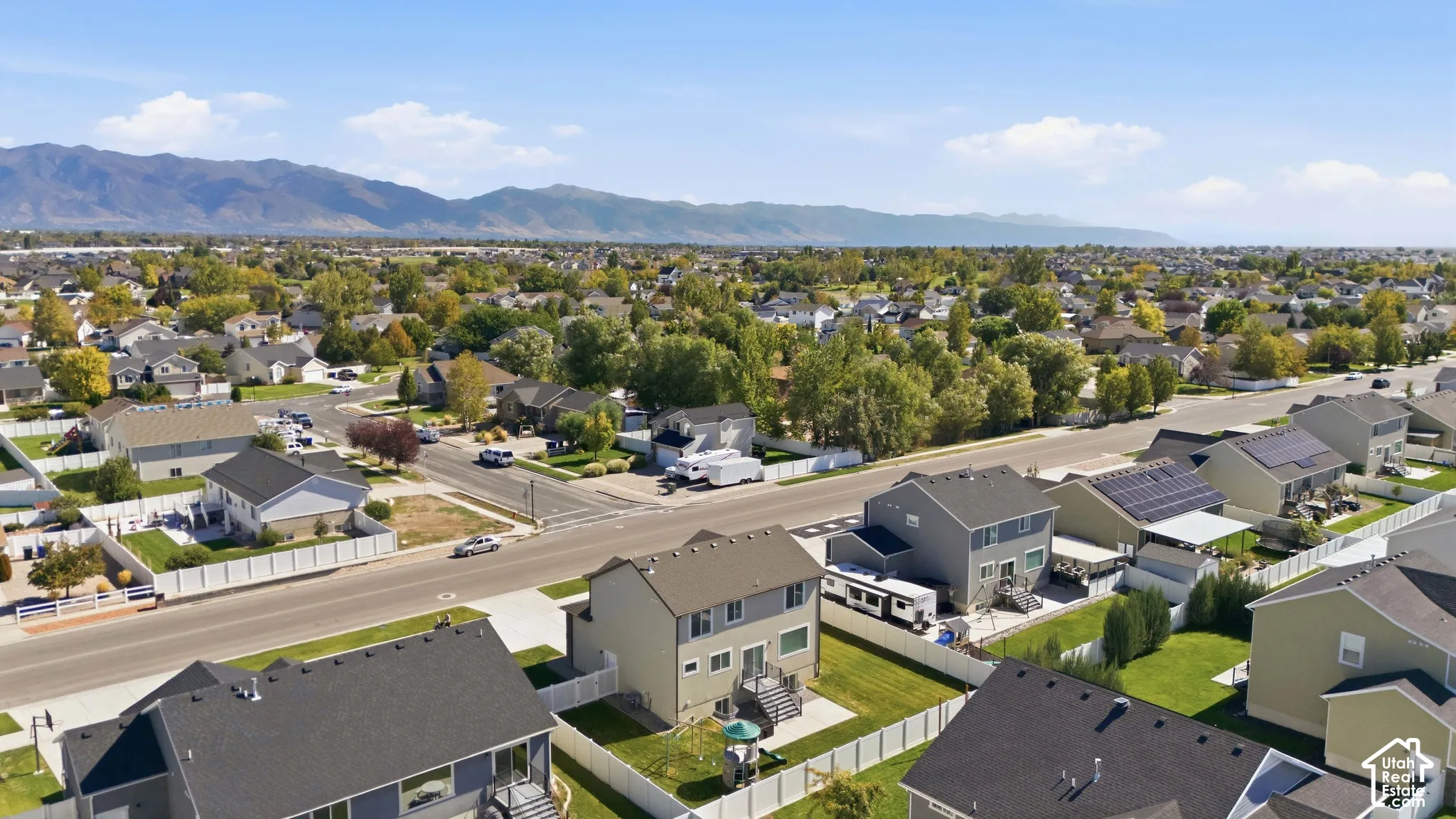 Aerial shot of backyard and mountain backdrop