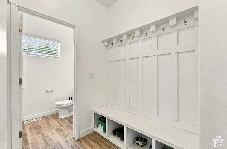 Built-in mudroom bench with cubby storage and coat hooks