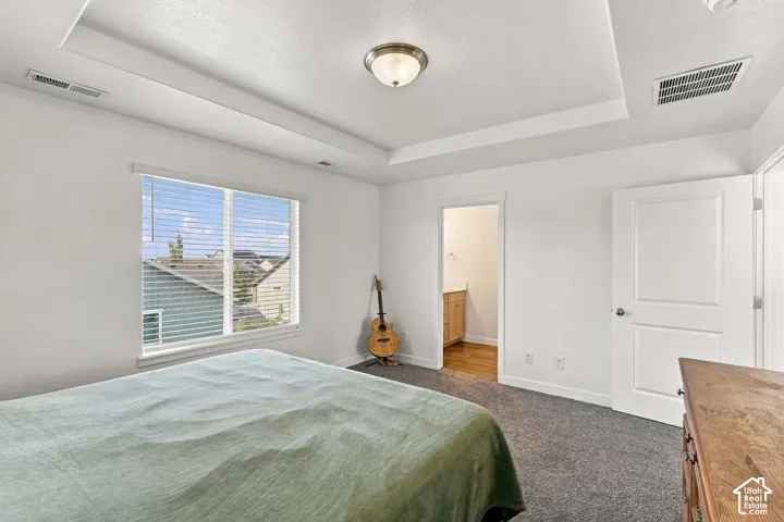 Primary bedroom with attached bath suite