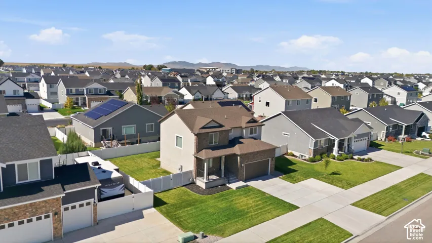 Aerial shot of front of home and neighborhood