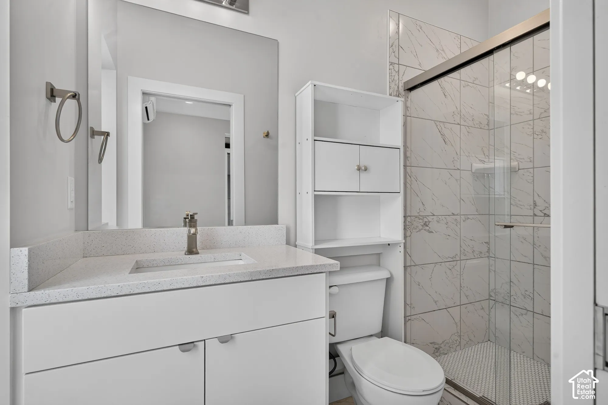 Modern vanity with an integrated sink and light-toned countertop
