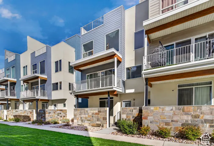 Modern multi-level townhome architecture with flat roofs