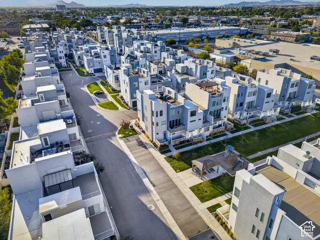 Modern multi-story residences featuring contemporary architecture, private balconies, and rooftop terraces