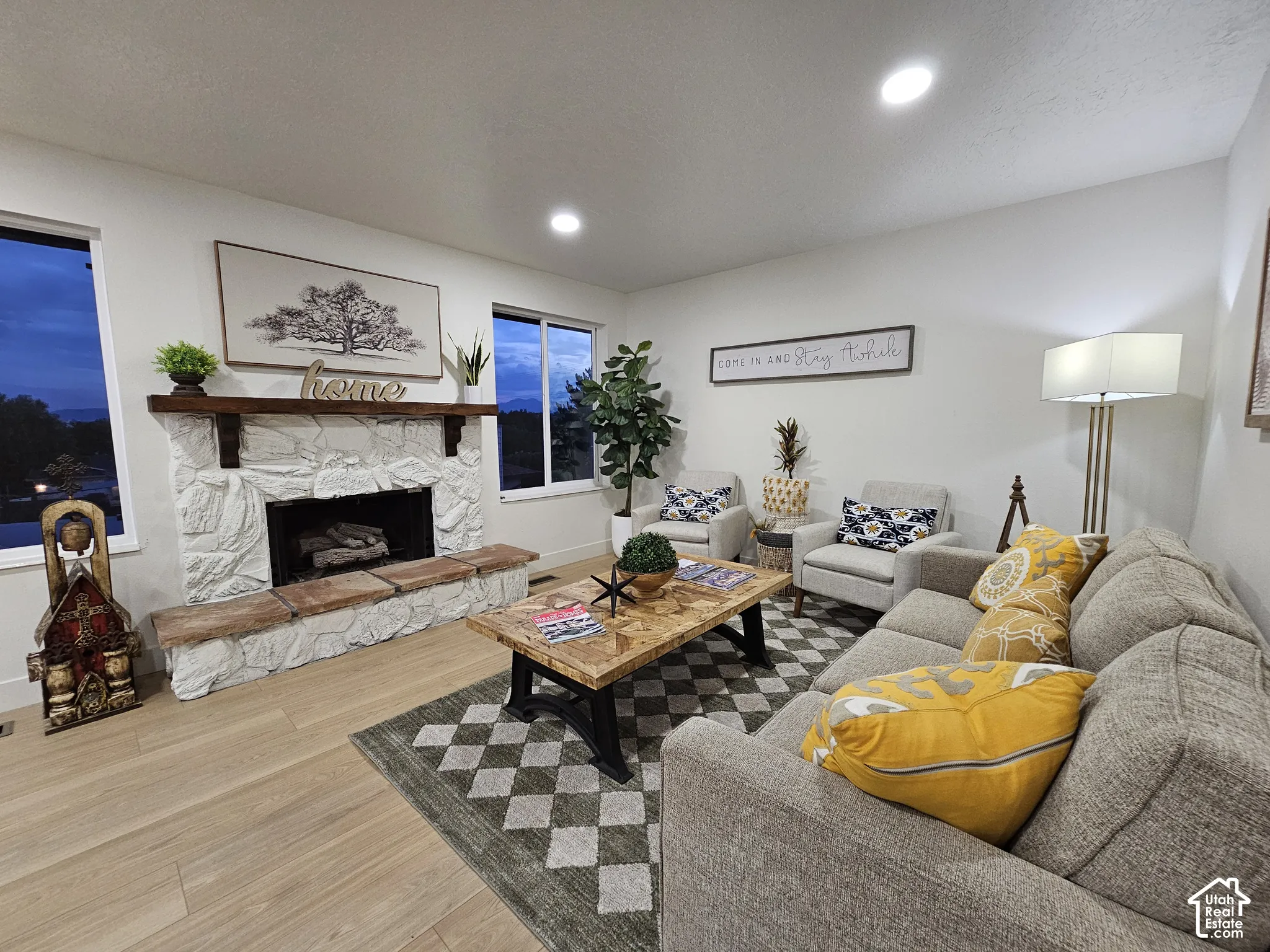 Recessed can lights and 2 big windows make the space feel light and bright