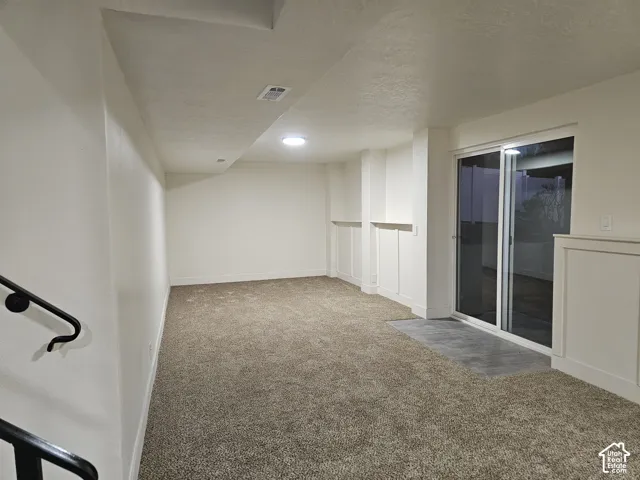 View of the Family Room from the bottom of the stairs