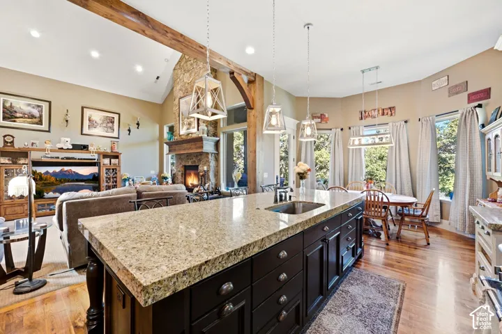Kitchen island with a granite countertop and integrated sink