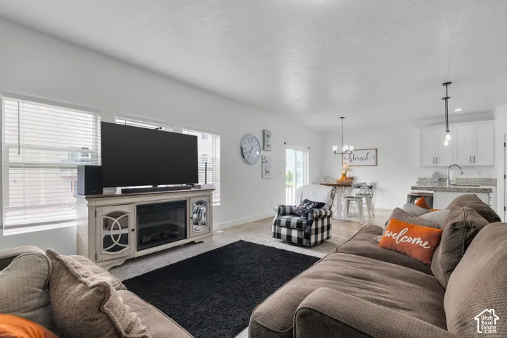 Open concept living area with light wood-finish flooring