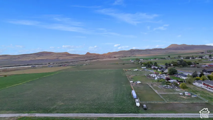 Expansive agricultural land bordering a residential area