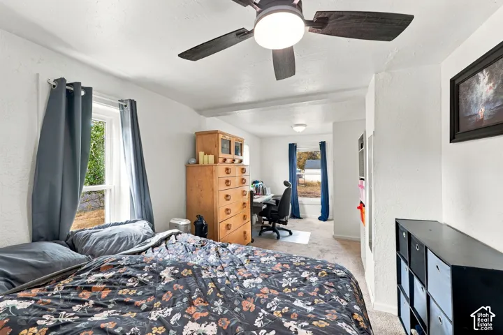 Recessed lighting, ceiling fan, and multiple windows with natural light