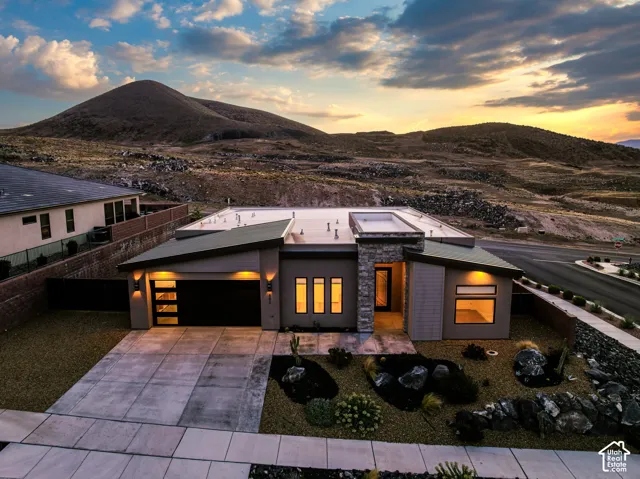 Modern architectural design with a flat roofline and exterior lighting