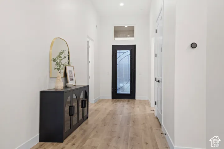 Wood-finish flooring throughout the hallway