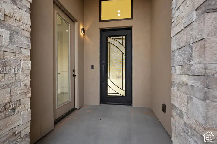 Stucco exterior finish with stacked stone accents