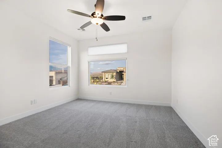 Neutral color palette with light gray carpeting