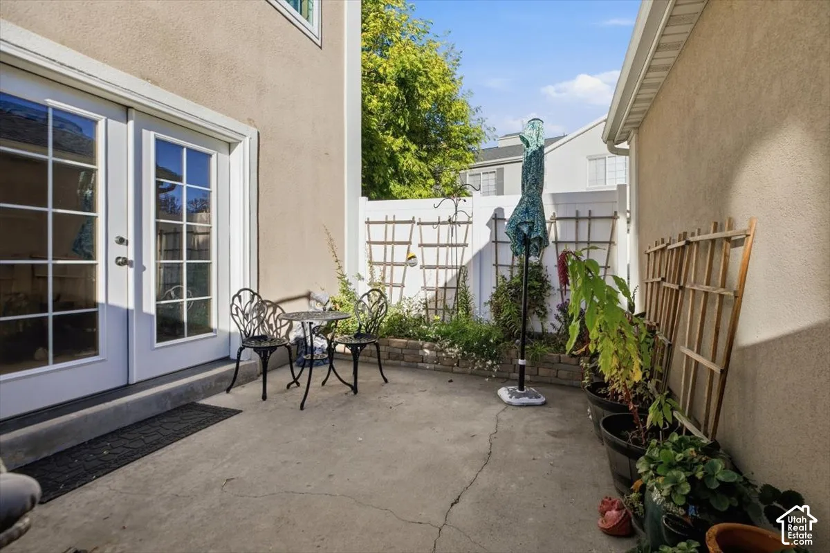 Concrete patio with direct access via French doors