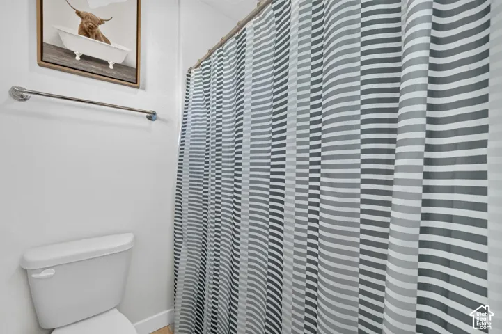 White toilet with a matching lid