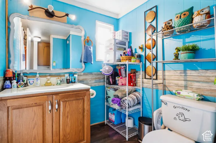 Wood-finish vanity with white countertop and integrated sink