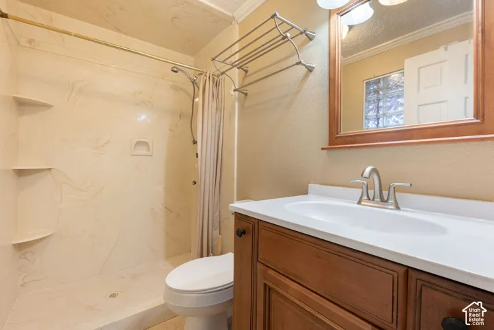 Built-in shower shelving, integrated shower bench, full vanity with white countertop, and framed vanity mirror