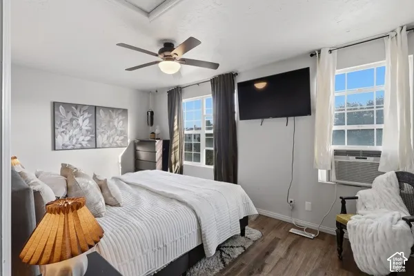 Wood-finish flooring with white baseboards
