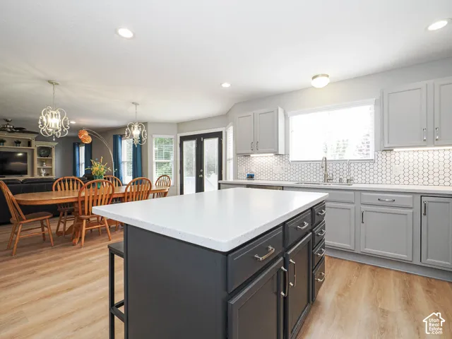 Bright open and updated kitchen looking into large dining and family rooms.