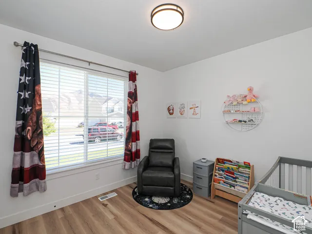 White walls with wood-finish flooring