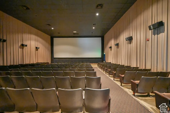 Large projection screen with integrated speakers and sound system