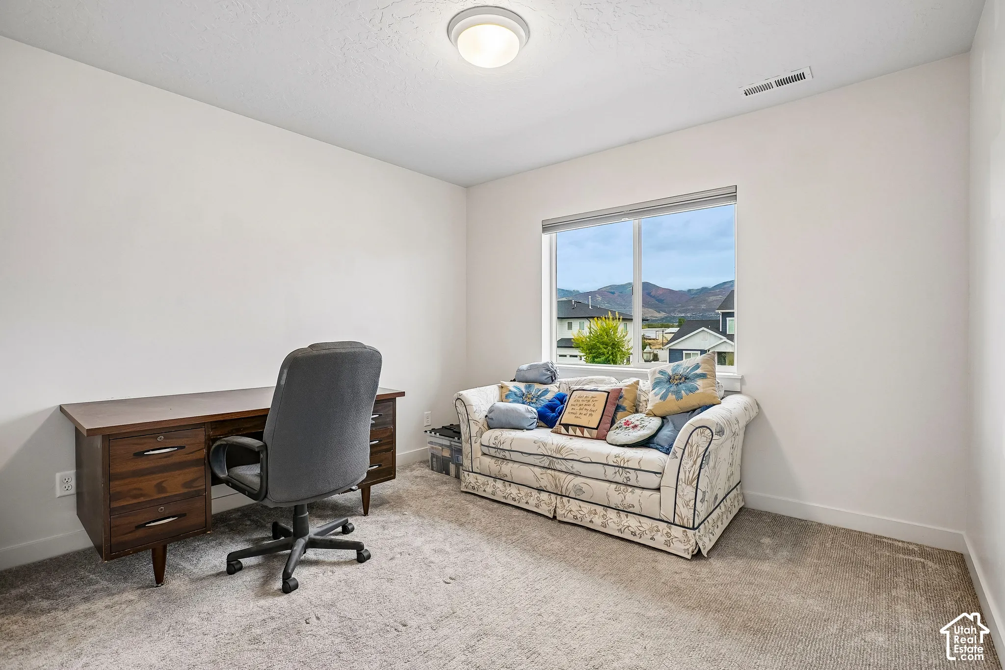 Neutral wall paint, recessed lighting, and carpeted flooring