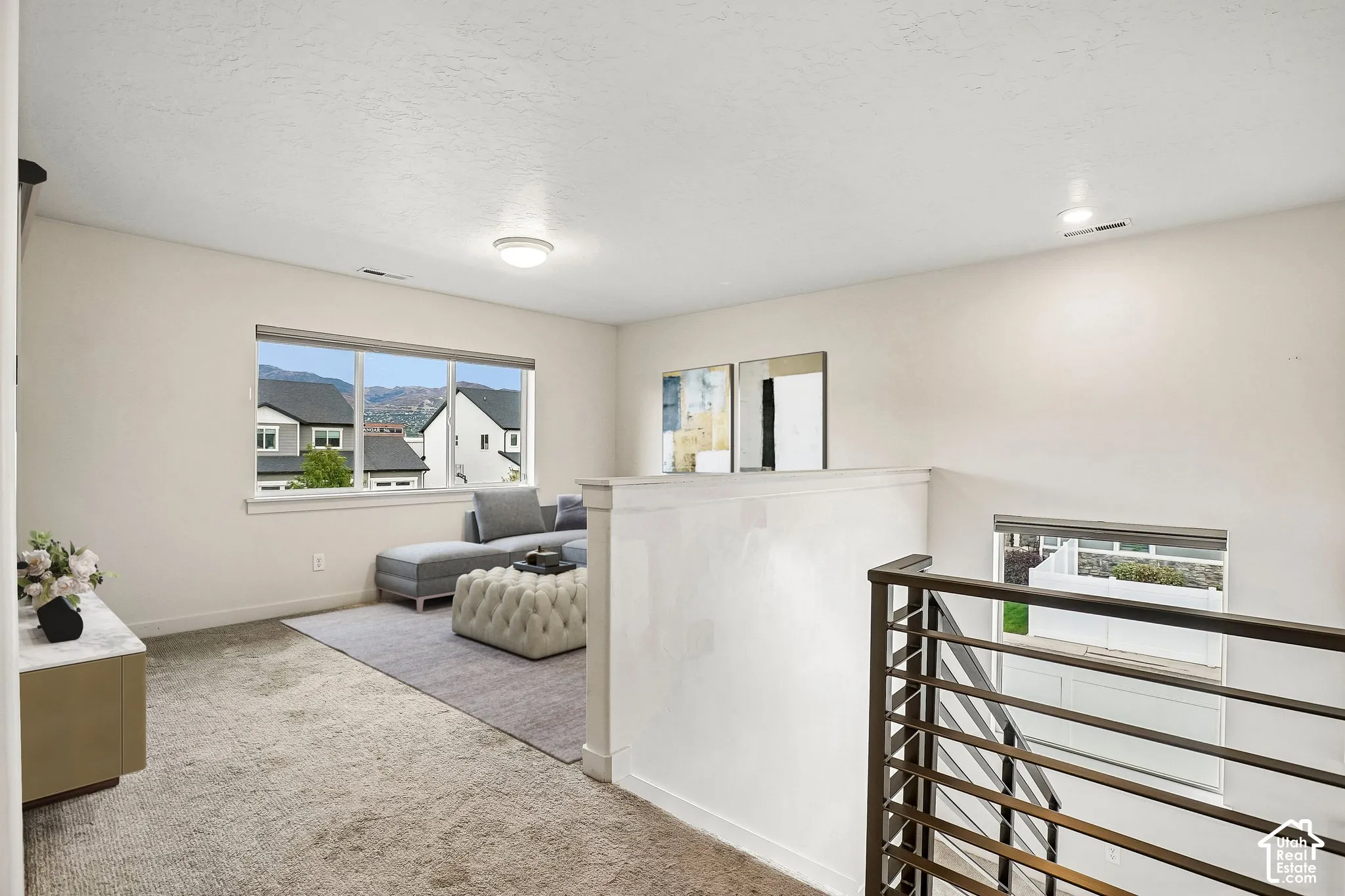 Spacious upper level with carpeted flooring