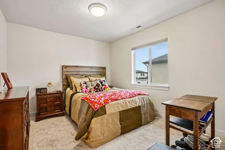 Recessed window with white trim, wall-to-wall carpeting, and a flush mount ceiling light fixture