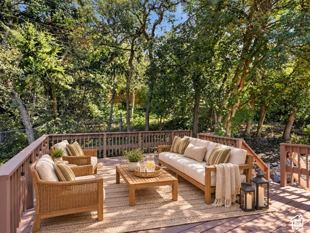 Expansive wood-finish deck with a built-in railing system and integrated string lighting