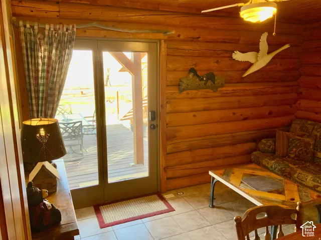 Full log wall construction with exposed wood beams