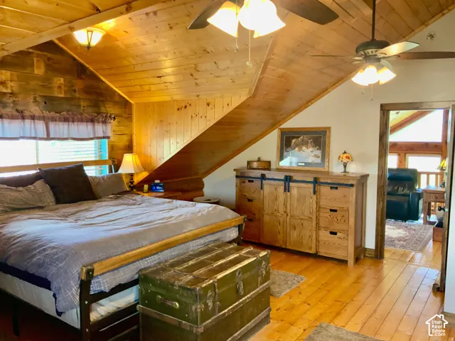 Wood-paneled ceilings with exposed beams and recessed lighting