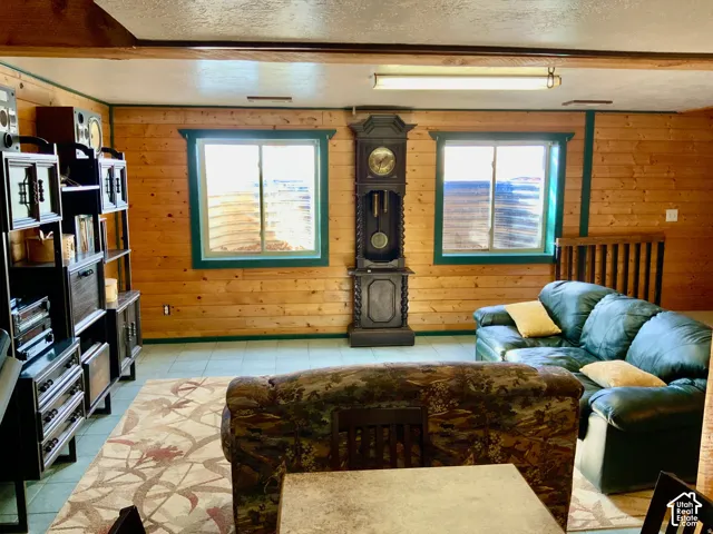 Wood-paneled walls and ceiling beams