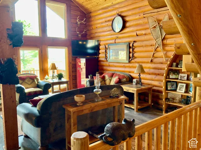 Log wall construction featuring exposed timber framing
