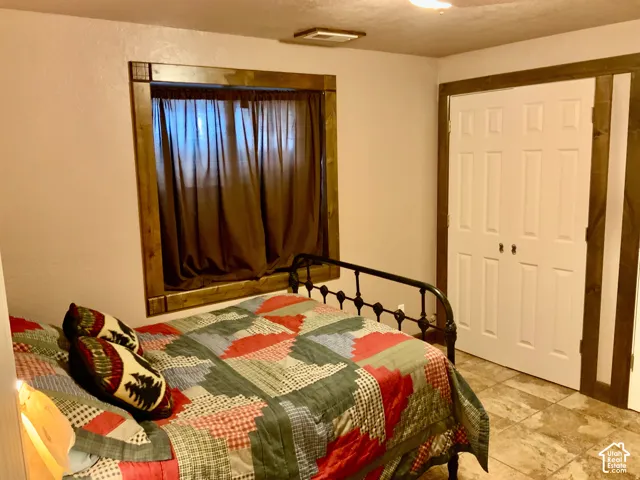 Wood-finish window trim, solid panel interior doors, and tile flooring