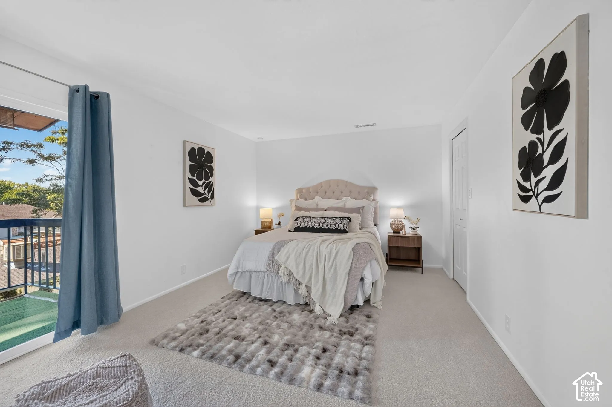 Spacious primary bedroom with deck access, a walk-in closet, and an ensuite bath.