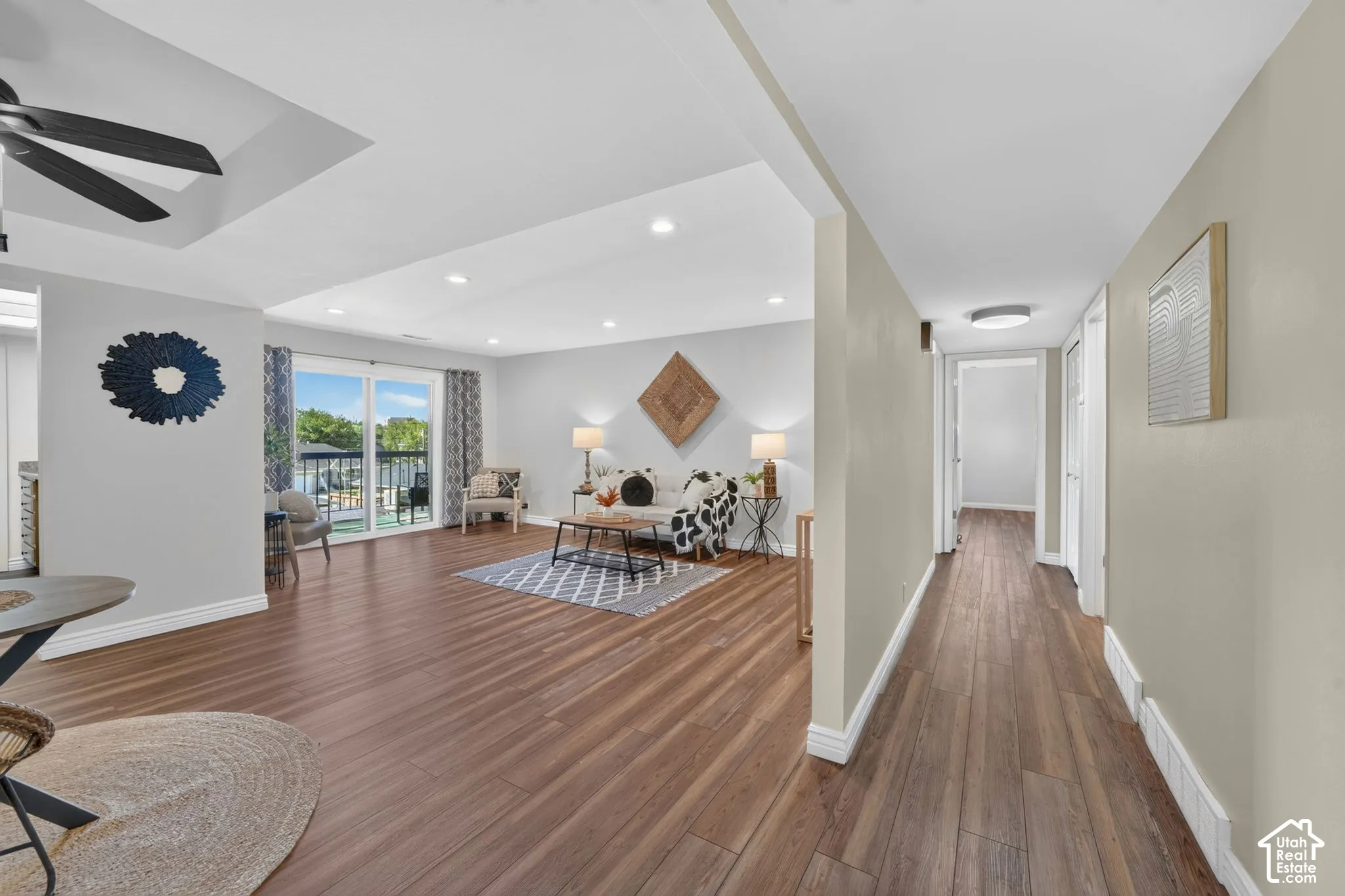 The entry opens to the living and dining area, with the hallway to the bedrooms straight ahead.
