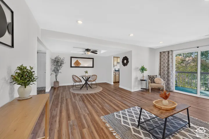 The living room flows into the dining area, with the sliding doors to the deck along one side.