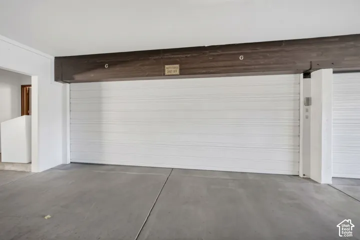The private two-car garage sits beneath the condo building and includes an EV charging station.