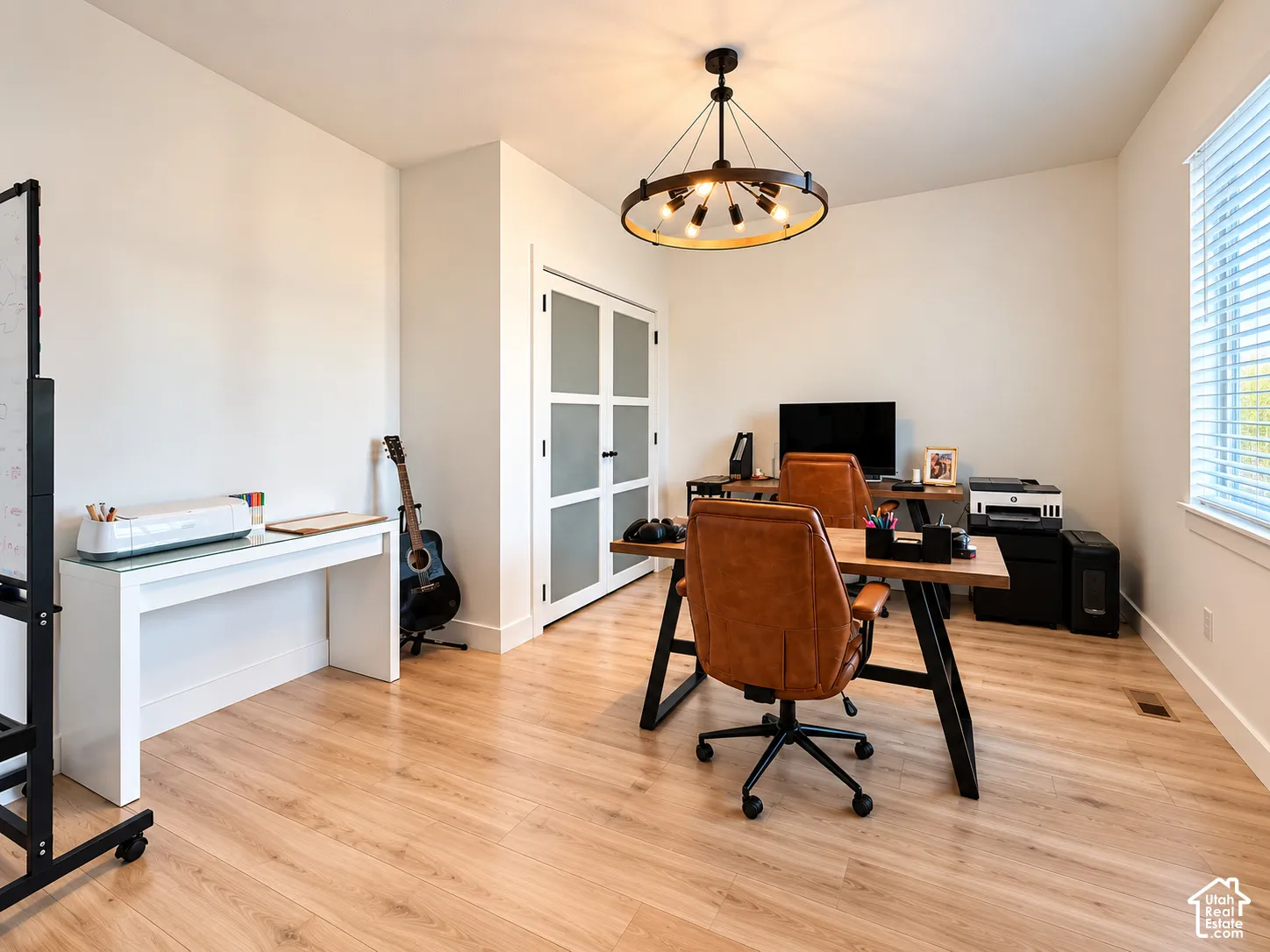 Light wood-finish flooring complements the neutral wall tones