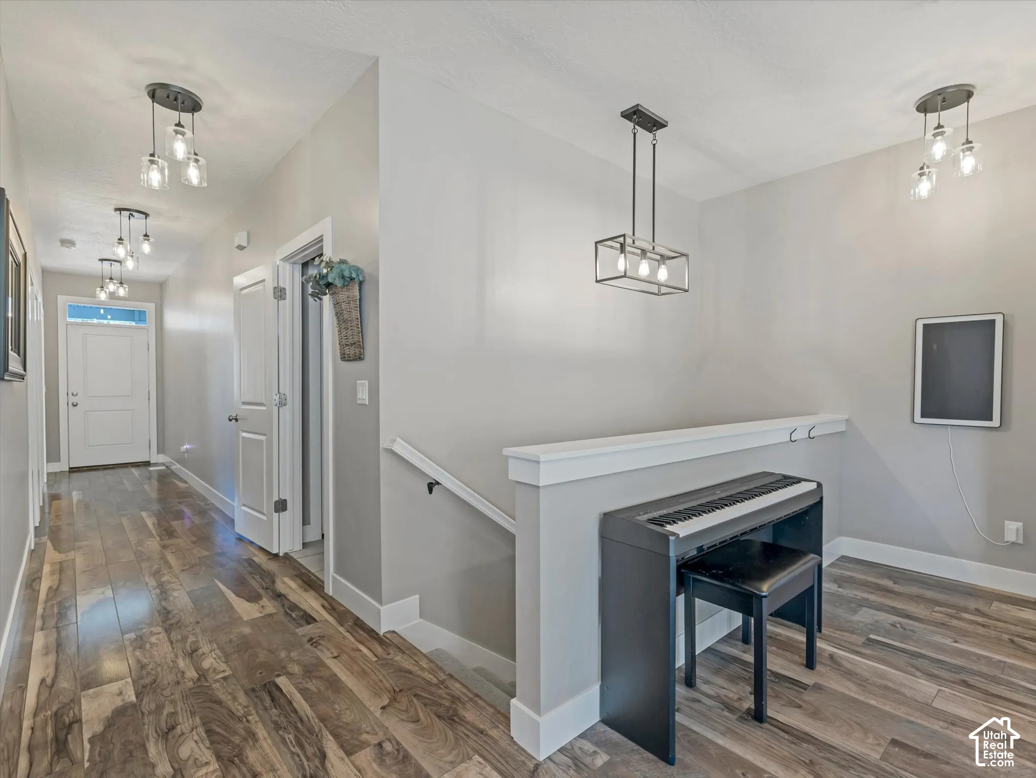 Wood-finish flooring throughout the hallway
