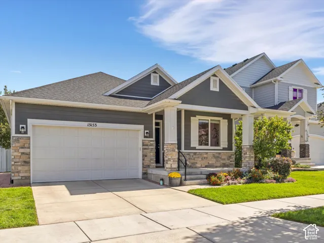 Crafted exterior featuring stone accents and horizontal siding