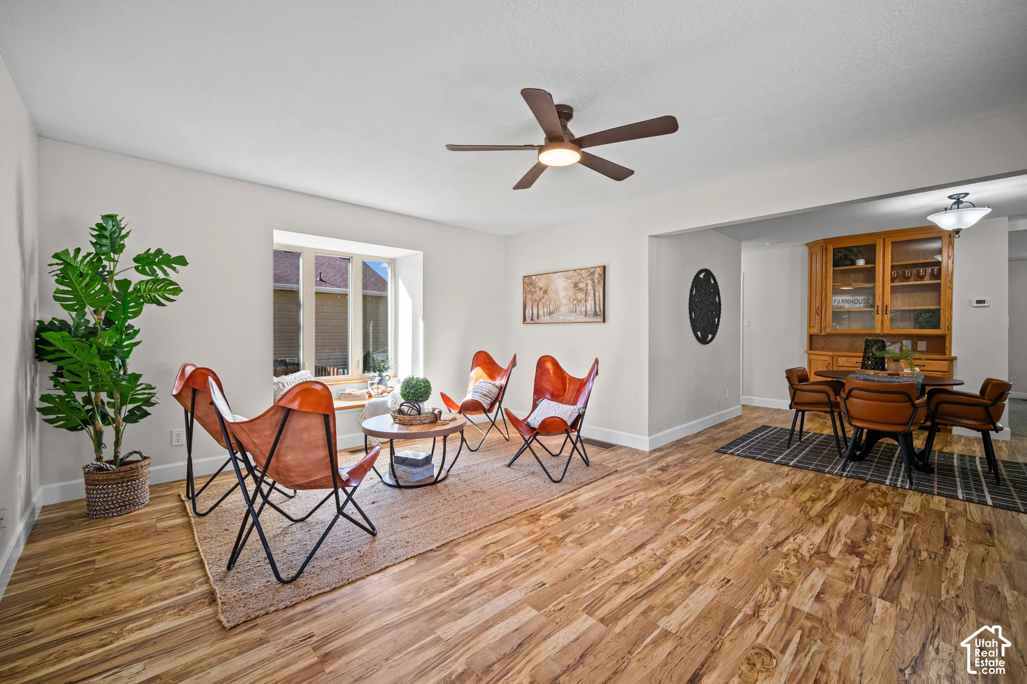 Wood-finish flooring throughout, complemented by light-colored walls