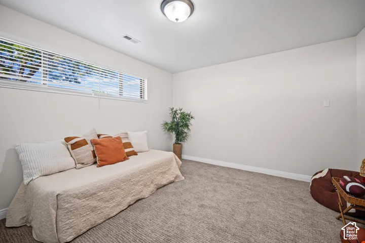 Recessed window with blinds, light gray walls, white trim, and a flush mount ceiling light fixture