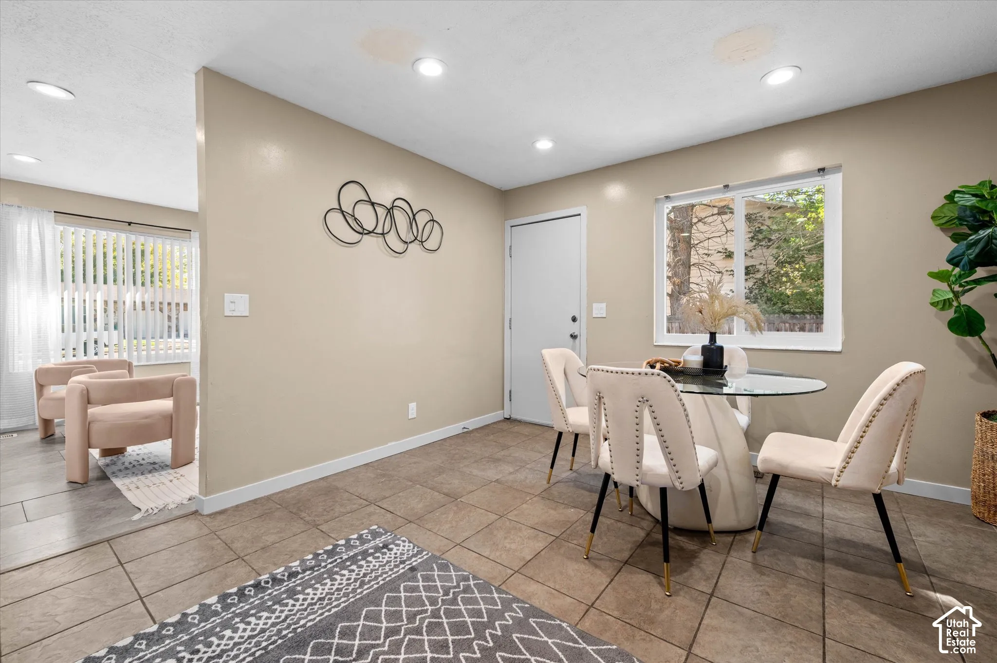 Recessed lighting, tile flooring, and a neutral color palette