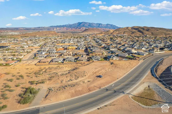 Expansive community with varied architectural styles under a clear sky